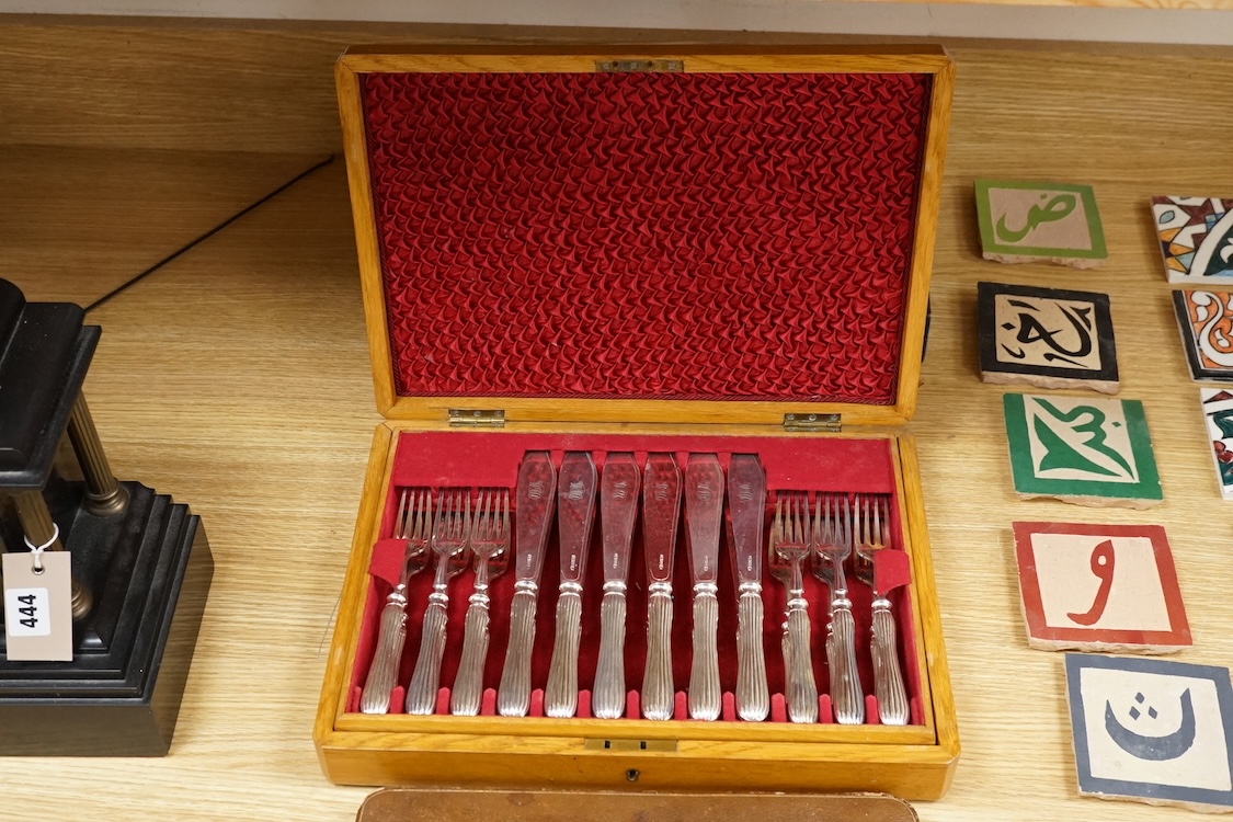 Four cased sets of silver plated flatware, including a carving set with antler handles, silver mounted.